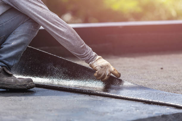Professional Basement Waterproofing technician working in Westwood, KY